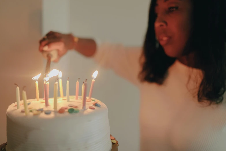 a woman blowing out candles on a birthday cake, pexels, essence, fan favorite, walking down, from waist up