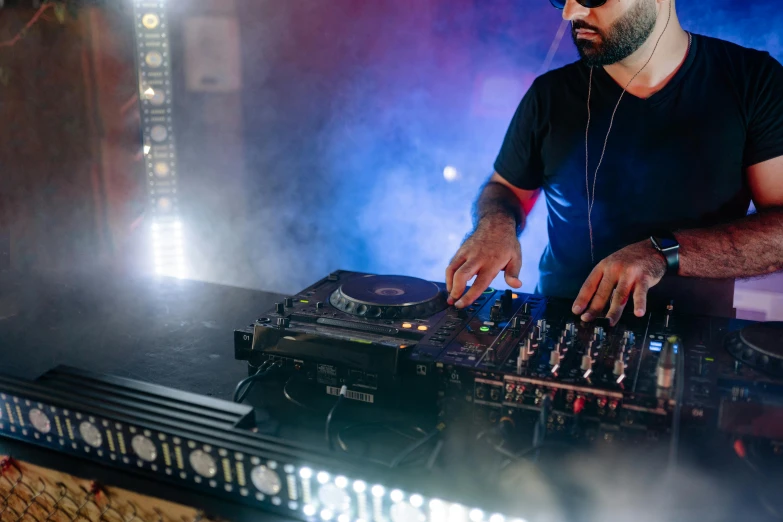 a man that is standing in front of a dj, pexels, reza afshar, performing, avatar image, 15081959 21121991 01012000 4k
