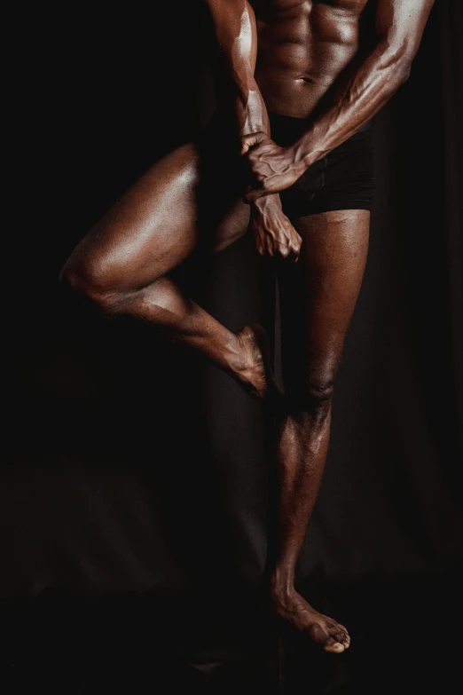 a male bodybuilde posing on a black background, an album cover, inspired by Robert Mapplethorpe, pexels contest winner, hyperrealism, thighs close up, african american woman, 7 0 years old, adut akech