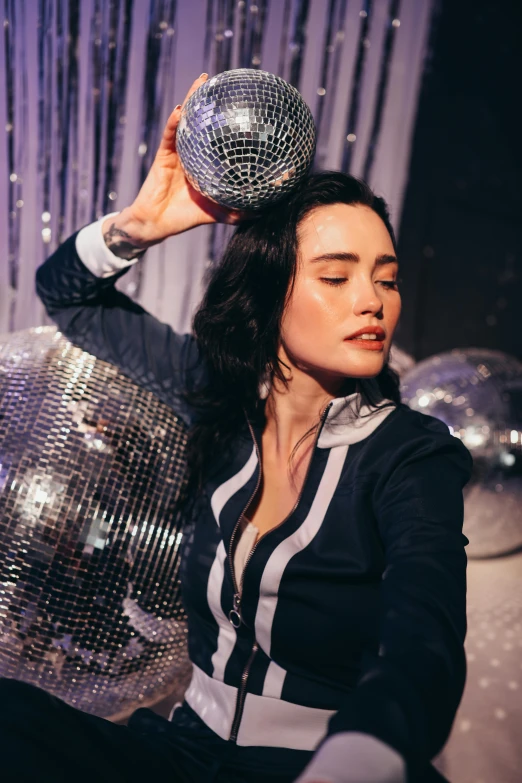 a woman holding a disco ball over her head, pexels contest winner, kitsch movement, jennifer connelly, dj at a party, mai anh tran, profile image