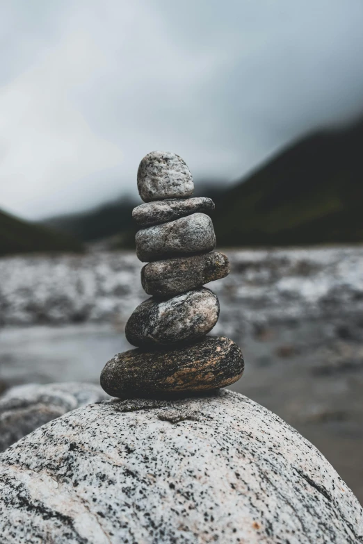 a stack of rocks sitting on top of a rock