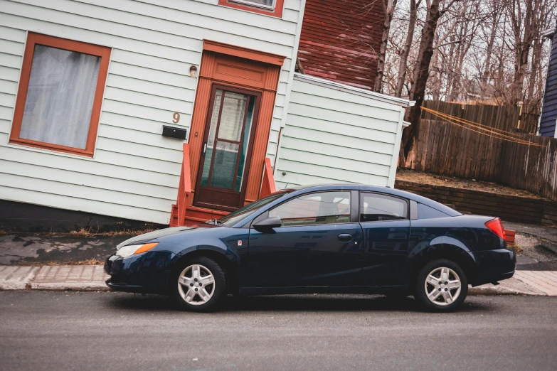 a blue car parked in front of a house, by Carey Morris, pexels contest winner, renaissance, standing in township street, right side profile, square, 2263539546]