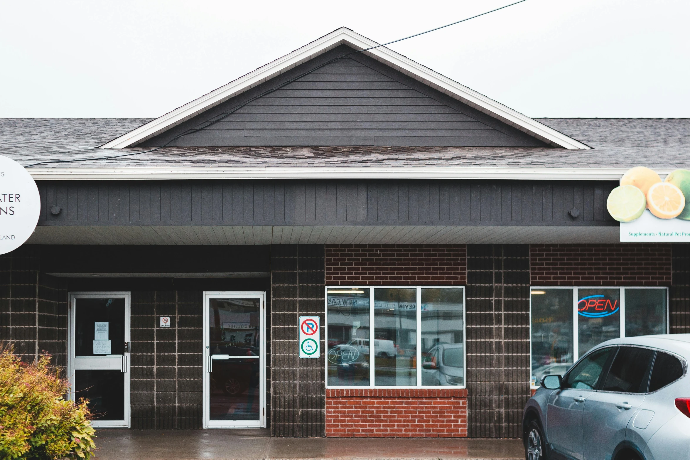 a building with a car parked in front of it, doctors office, dunwall city, exterior photography, thumbnail