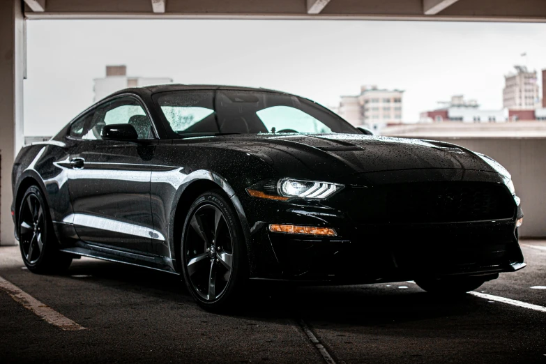 a black mustang parked in a parking garage, pexels contest winner, fan favorite, instagram picture, low iso, 8 k - n 9