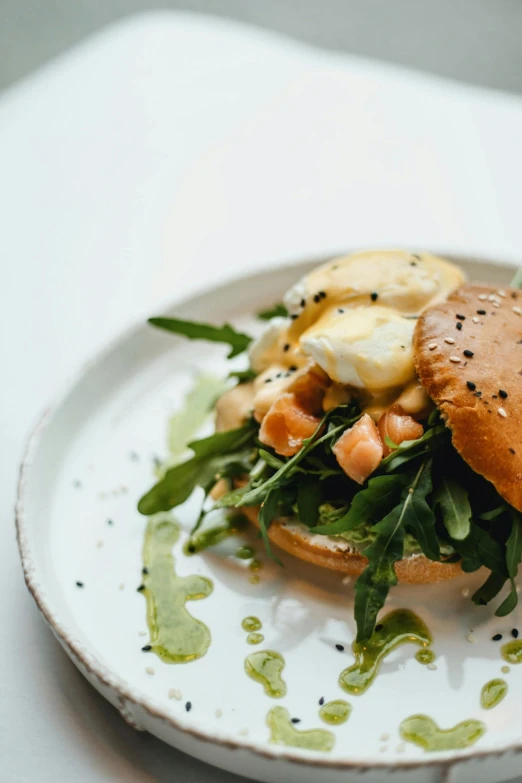 a close up of a plate of food on a table, bun ), profile image, abcdefghijklmnopqrstuvwxyz, medium level shot