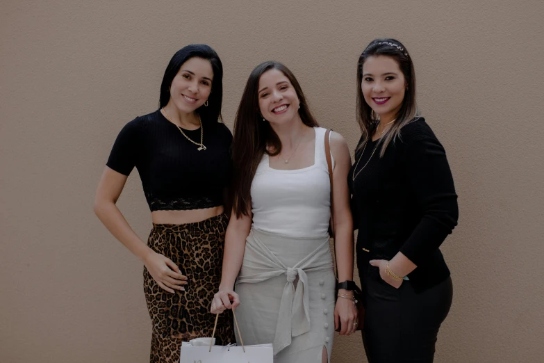 three women standing next to each other holding shopping bags, a picture, by Robbie Trevino, avatar image, hispanic, jewelry, high quality image