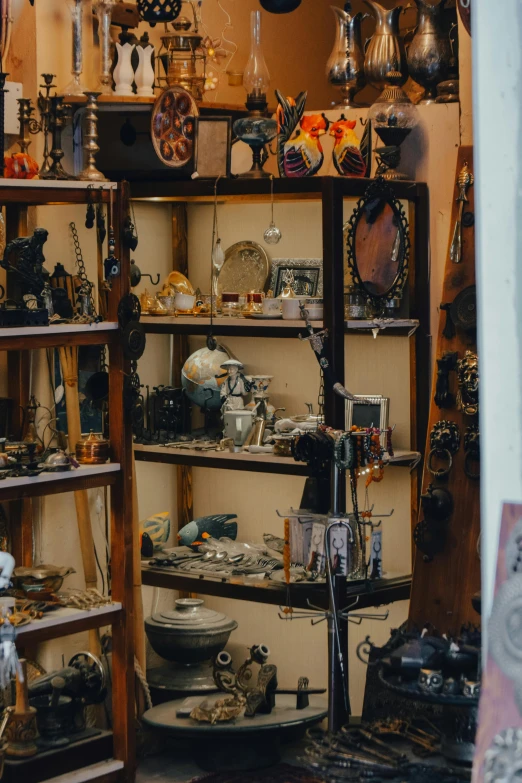 a room filled with lots of assorted items, by Andries Stock, trending on pexels, assemblage, shelves full of medieval goods, occult jewelry, inspect in inventory image, instagram post