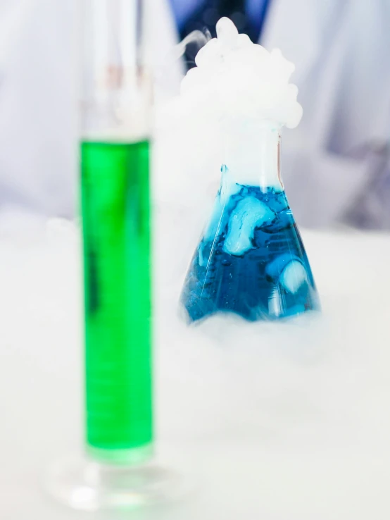 a close up of a person in a lab coat, bright blue smoke, lava lamps, blue and green, college