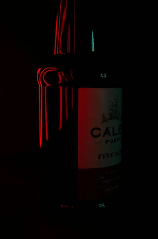 a bottle of wine sitting on top of a table, a 3D render, by Celia Fiennes, dark glowing red aura, glowing red laser eyes, port, photo product