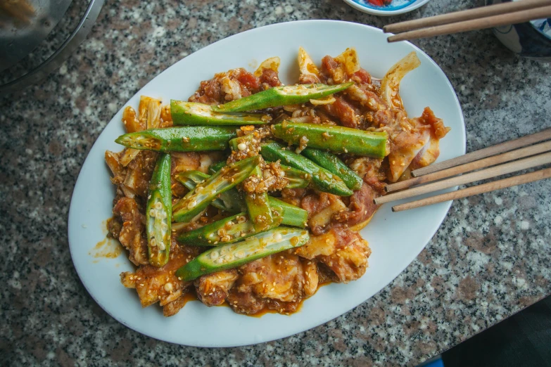 a close up of a plate of food with chopsticks, sichuan, avatar image, fan favorite, naranbaatar ganbold