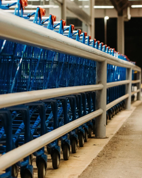 a row of blue shopping carts sitting next to each other, pexels, multiple stories, gif, plows, profile image