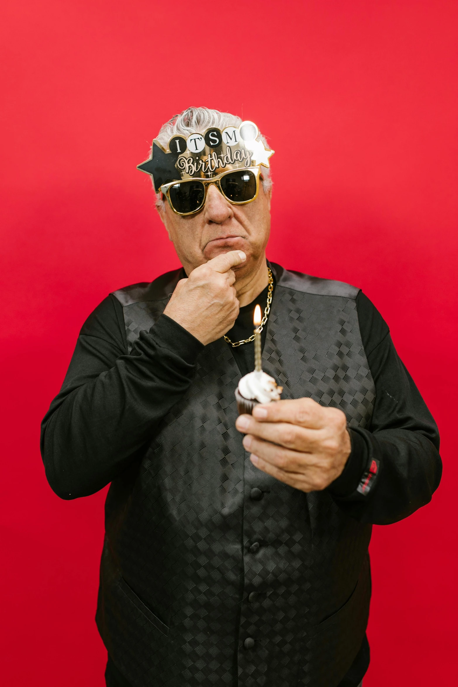 a man in a hat and sunglasses smoking a cigarette, an album cover, toyism, jay leno with gray skin, on black background, danny de vito, taken with sony alpha 9