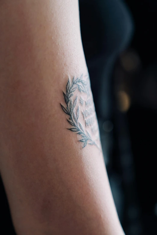 a person with a tattoo on their arm, wearing a laurel wreath, zoomed out shot, tall shot, synthetic bio skin