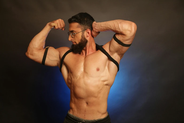 a man with a beard and glasses flexing his muscles, inspired by Volkan Baga, body harness, profile image, trending photo, pvc poseable