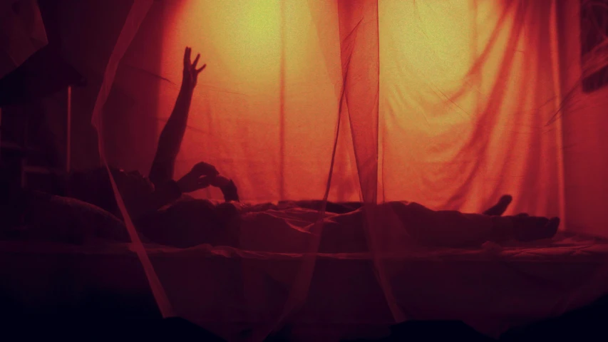 a person laying in a bed under a red light, pexels contest winner, surrealism, spirits covered in drapery, lo fi, hands reaching for her, ( ( theatrical ) )