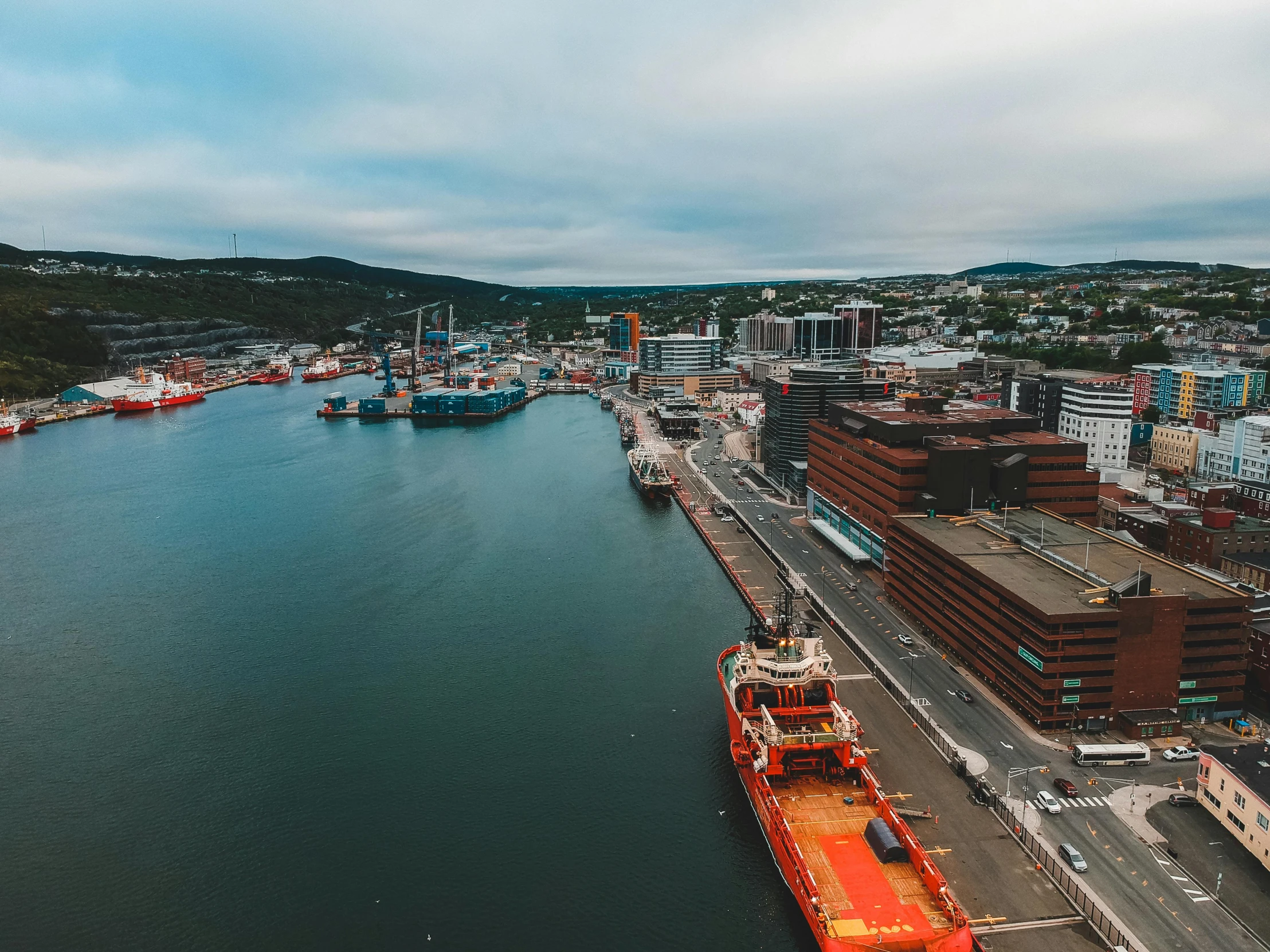 a large body of water next to a city, by Brian Snøddy, pexels contest winner, hurufiyya, shipyard, wide high angle view, brightly coloured, port