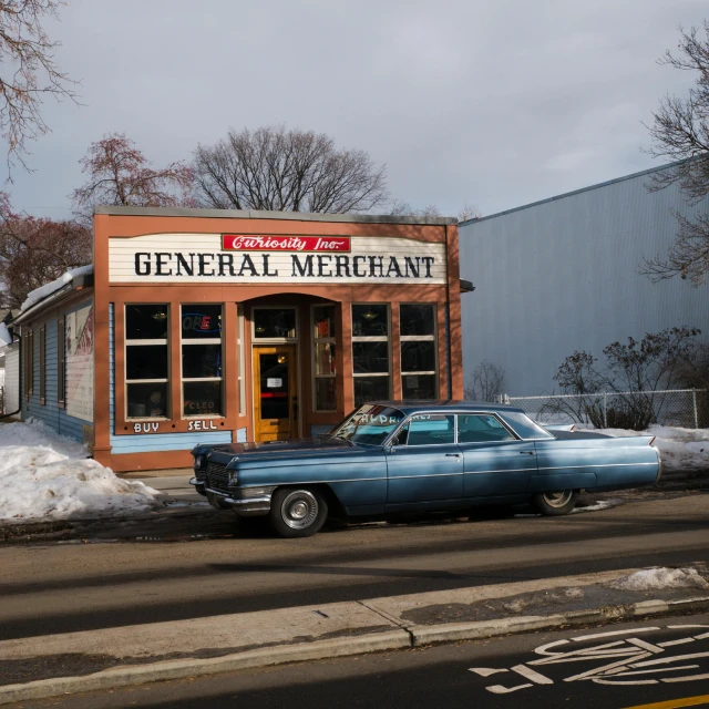 a blue car parked in front of a building, by Gwen Barnard, convenience store, daniel merrian :: ornate, greg rutkowski winter, preserved historical