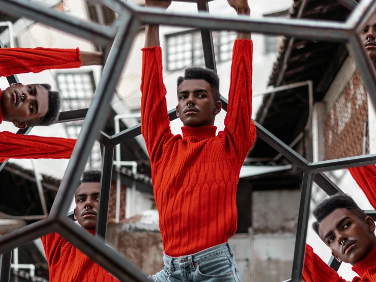 a group of men standing on top of a metal structure, pexels contest winner, afrofuturism, wearing a red turtleneck sweater, looking in mirror, male calisthenics, non binary model