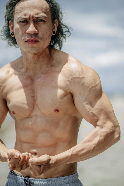 a shirtless man standing on top of a beach, an album cover, pexels contest winner, korean muscle boy 2 1 years old, david shing, extremely hyperdetailed, curls on top