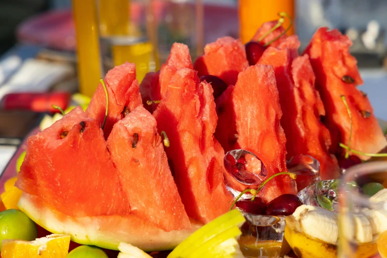 a close up of a plate of fruit on a table, at a beach party in ibiza, watermeloncore, fan favorite, gourmet