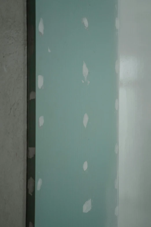 a white toilet sitting in a bathroom under construction, a detailed painting, inspired by Lucio Fontana, deviantart, ((greenish blue tones)), rinko kawauchi, [ closeup ]!!, paintchips