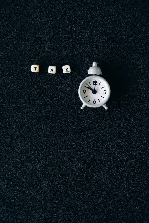 a white alarm clock sitting on top of a black surface, an album cover, by Andries Stock, trending on pexels, conceptual art, dice, taxi, 0, icon