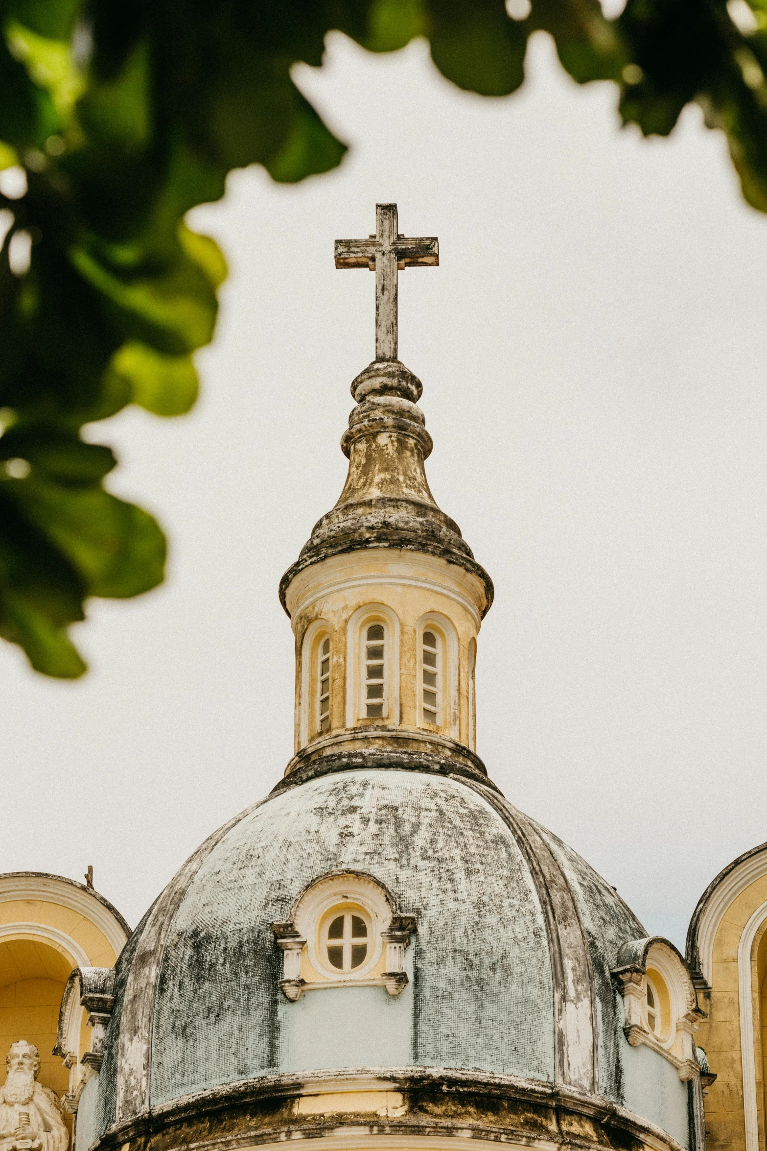 a church with a cross on top of it, inspired by Christopher Wren, trending on unsplash, baroque, brazilian, square, dome, low quality photo