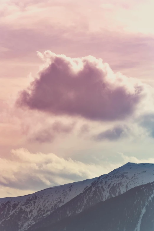 a man riding a snowboard on top of a snow covered slope, inspired by Elsa Bleda, trending on unsplash, romanticism, pink and grey clouds, prismatic cumulus clouds, “puffy cloudscape, in muted colours