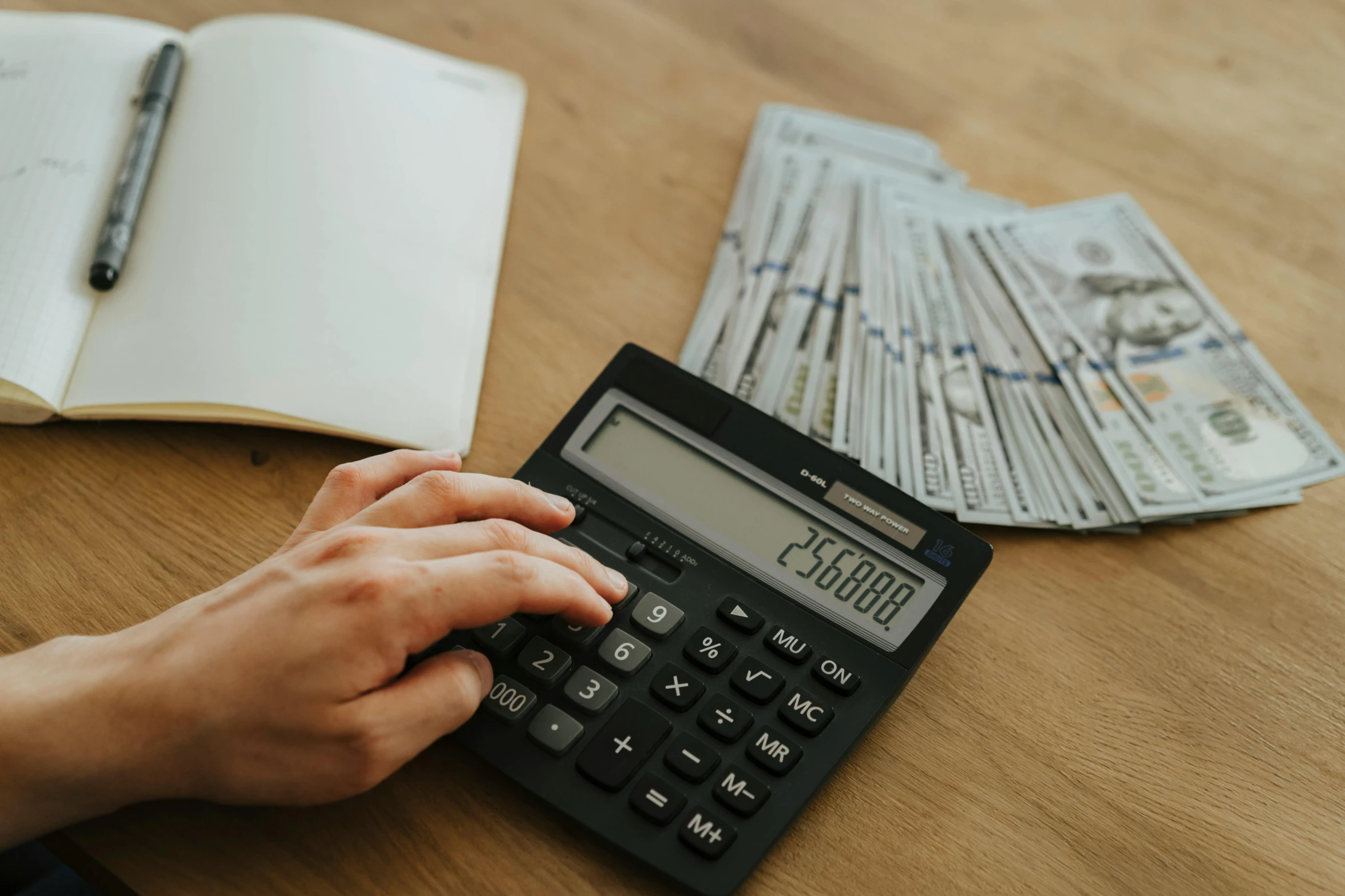 a person using a calculator on a table, by Carey Morris, pexels contest winner, hurufiyya, cash, avatar image, 2263539546], bridge