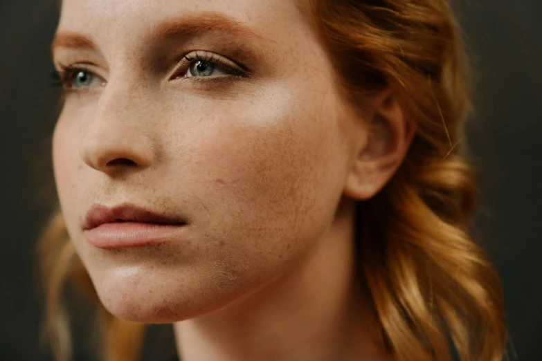 a close up of a woman with freckles on her face, a stipple, by Emma Andijewska, trending on pexels, a redheaded young woman, skincare, young blonde woman, realistic skin shader