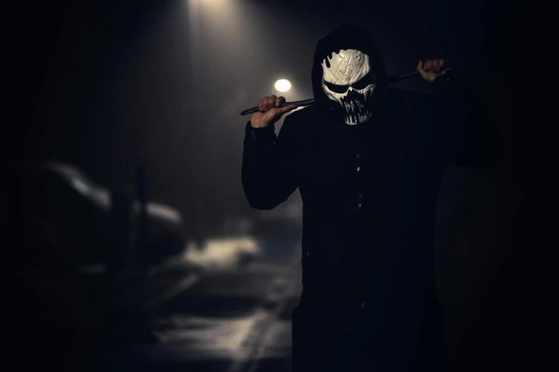 a man in a mask holding a baseball bat, by Adam Marczyński, pexels contest winner, venom symbiote, avatar image, punisher, wearing a dark hood