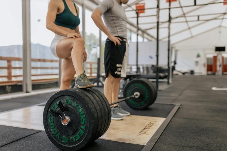 a man and a woman in a crossfit gym, pexels contest winner, on the concrete ground, manly, detailed and complex, profile image