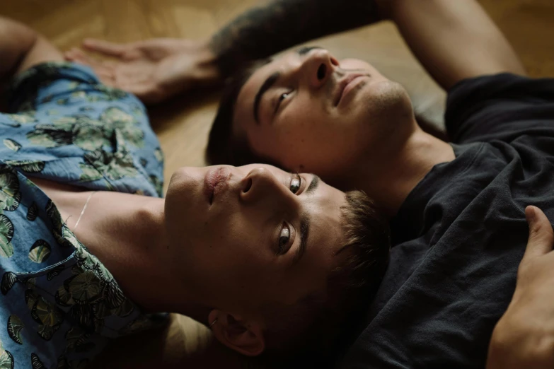 a man and a woman laying on the floor, a portrait, trending on pexels, hyperrealism, lesbians, two handsome men, close-up portrait film still, teenage boy