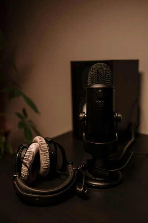 a pair of headphones sitting on top of a desk, by Niko Henrichon, hurufiyya, studio microphone, pitch black room, icon, mount