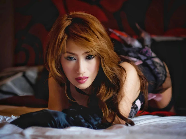 a beautiful young woman laying on top of a bed, tachisme, asian descend, with red hair, looking intensely at the camera, profile image