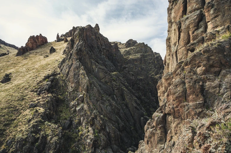 a group of people standing on top of a mountain, flying buttresses, hyperdetailed photo, idaho, fan favorite