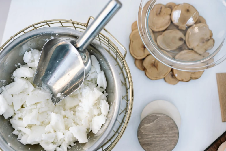 a bowl filled with rice sitting on top of a table, building mushrooms, metal kitchen utensils, hammershøi, thumbnail