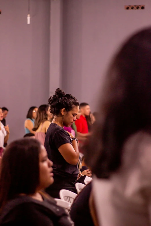 a group of people sitting in a room, by Briana Mora, trending on unsplash, many people worshipping, brazil, background image, pray