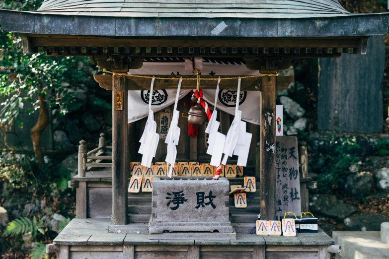 a small shrine in the middle of a forest, unsplash, sōsaku hanga, 90s photo, fan favorite, 🦩🪐🐞👩🏻🦳, japanese rural town