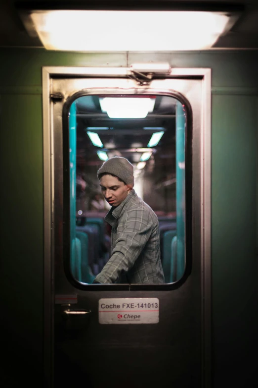 a man is looking out the window of a train, by Adam Marczyński, unsplash contest winner, hyperrealism, non binary model, night life, eminem, ignant