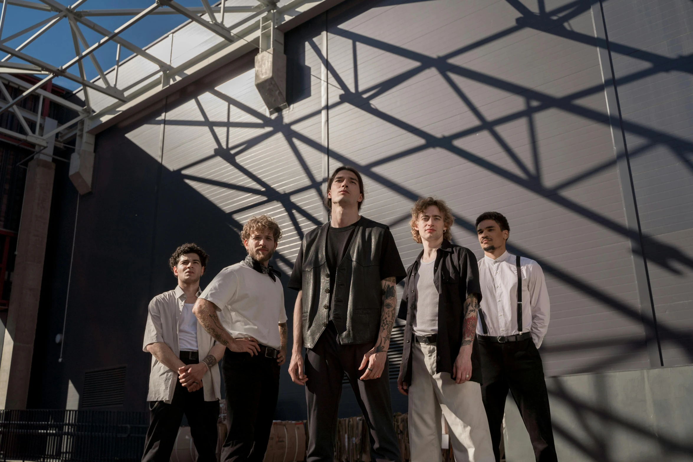 a group of young men standing next to each other, an album cover, pexels contest winner, afternoon lighting, with white skin, architectural shot, scattered light