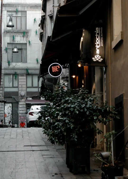 a city street filled with lots of tall buildings, an album cover, pexels contest winner, renaissance, cafe lighting, greek, grey, melbourne