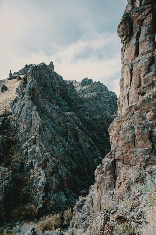 a group of people standing on top of a mountain, jagged rocks, complex details, unsplash 4k, wyoming