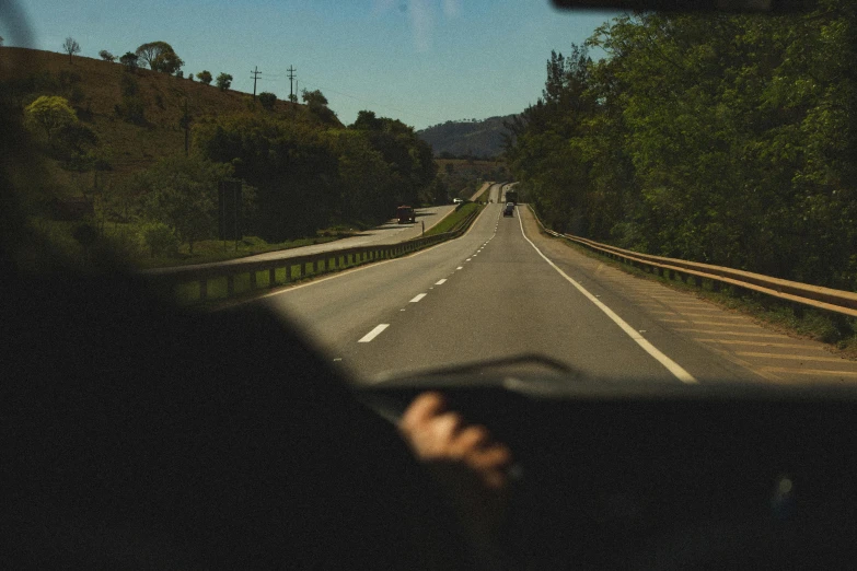 a person driving a car on a highway, unsplash, napa, cardboard, digital image, thumbnail