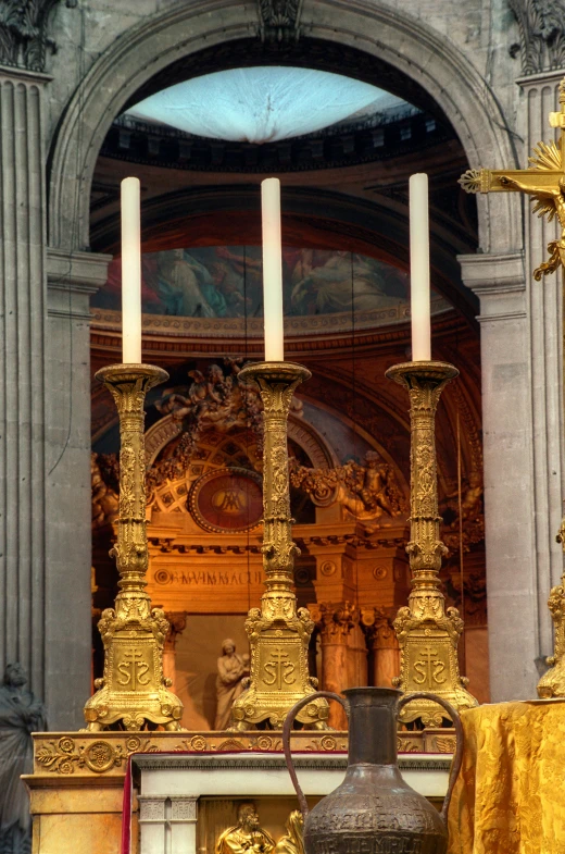 a church altar with a gold cloth draped over it, by Gian Lorenzo Bernini, baroque, on a candle holder, in paris, buttresses, triptych