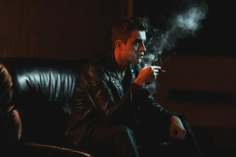 a man sitting on a couch smoking a cigarette, an album cover, inspired by Elsa Bleda, pexels contest winner, leather jackets, declan mckenna, gentleman's club lounge, profile image