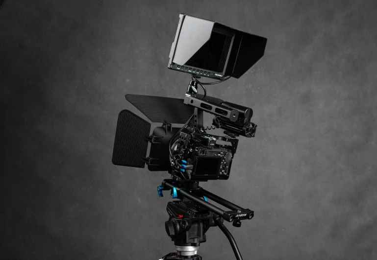 a camera that is sitting on a tripod, production quality cinema model, back towards camera, on black background, tilted frame