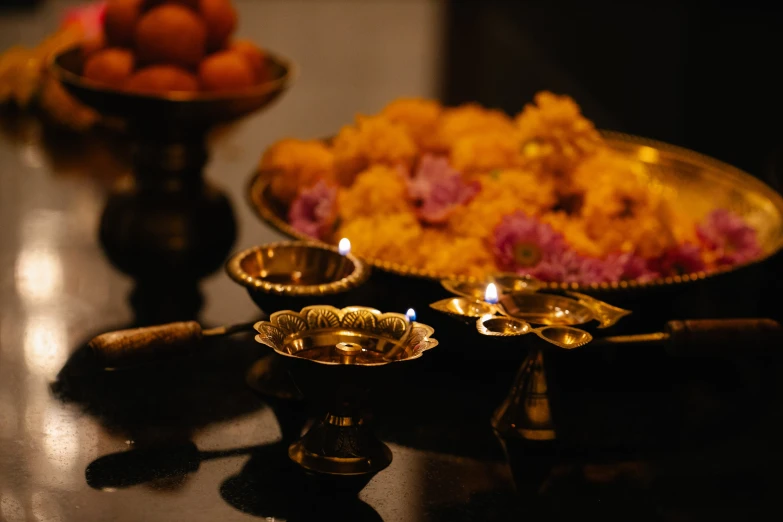 a close up of a plate of food on a table, a still life, pexels contest winner, hurufiyya, hindu ornaments, lights with bloom, thumbnail, gold