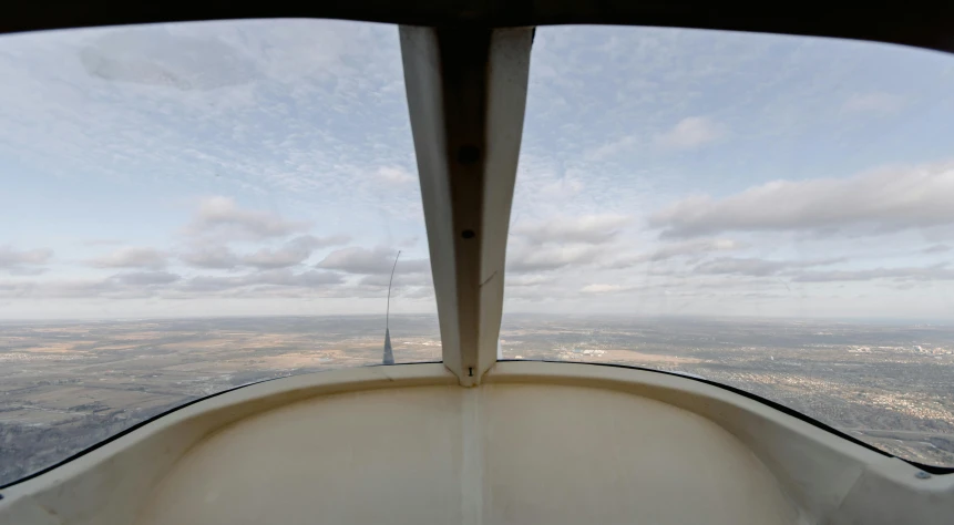 a view from the cockpit of a small plane, hurufiyya, lookout tower, photographed for reuters, inside a grand, spire