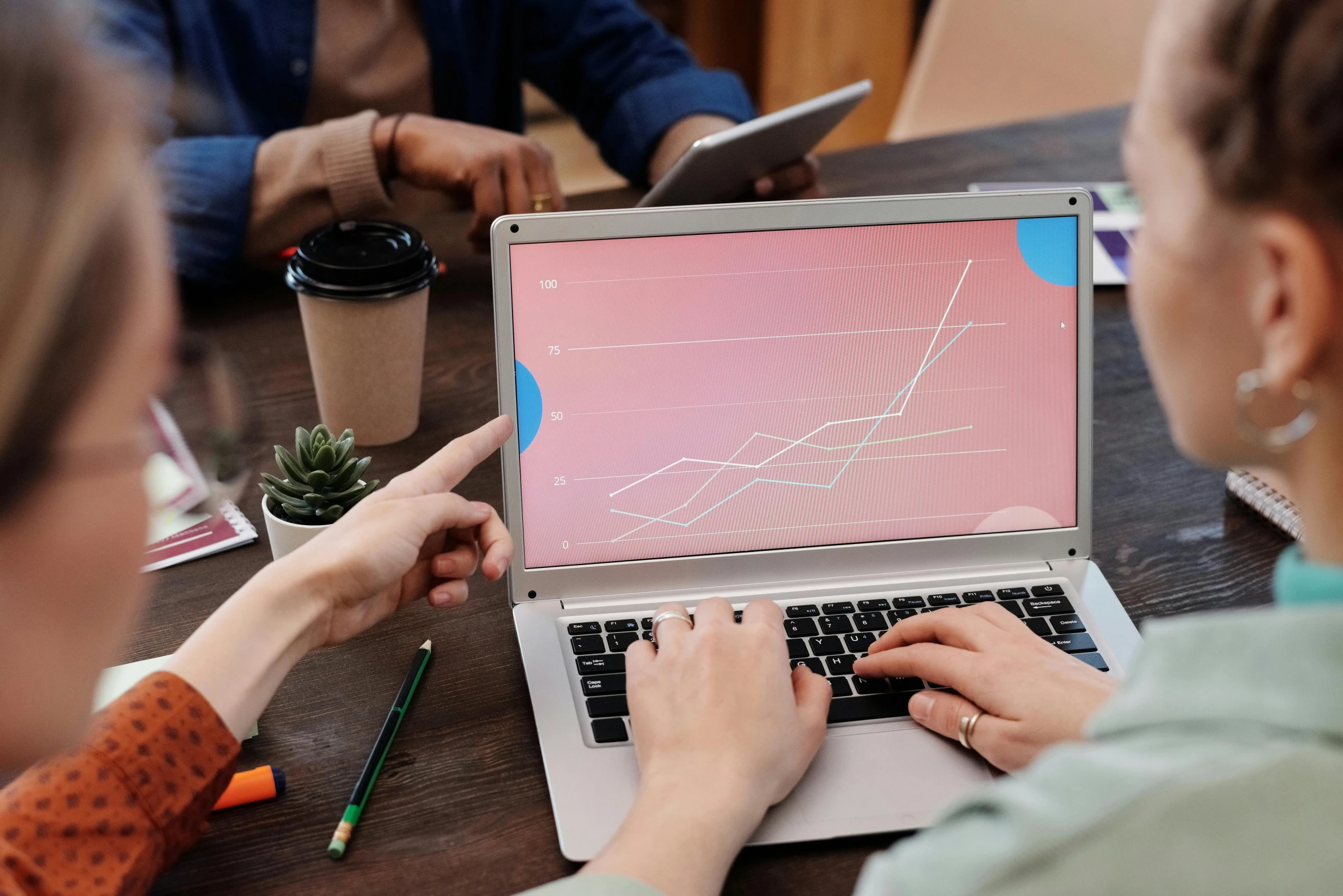 a group of people sitting at a table with laptops, trending on pexels, analytical art, graph design, avatar image, closeup photograph, 1 2 9 7